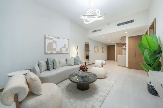 Ultra-modern and sophisticated apartment in Business Bay’s Missoni Tower, designed with chic neutral tones, curved furnishings, and contemporary artwork.